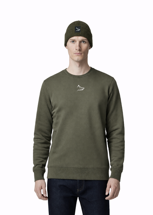 Man wearing a Northwind embroidered wolf logo khaki green sweatshirt and an olive green Northwind organic cotton beanie, and dark pants on a light gray background