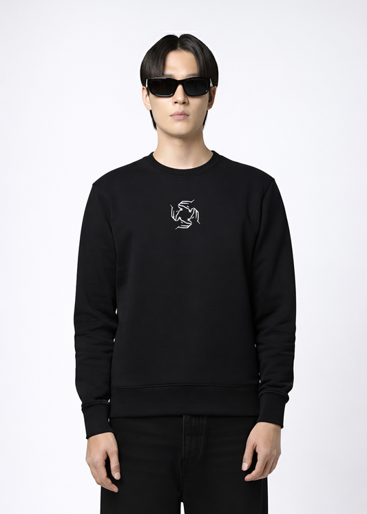 Person wearing a black Northwind sweatshirt with Northwind wolf storm logo on a white background