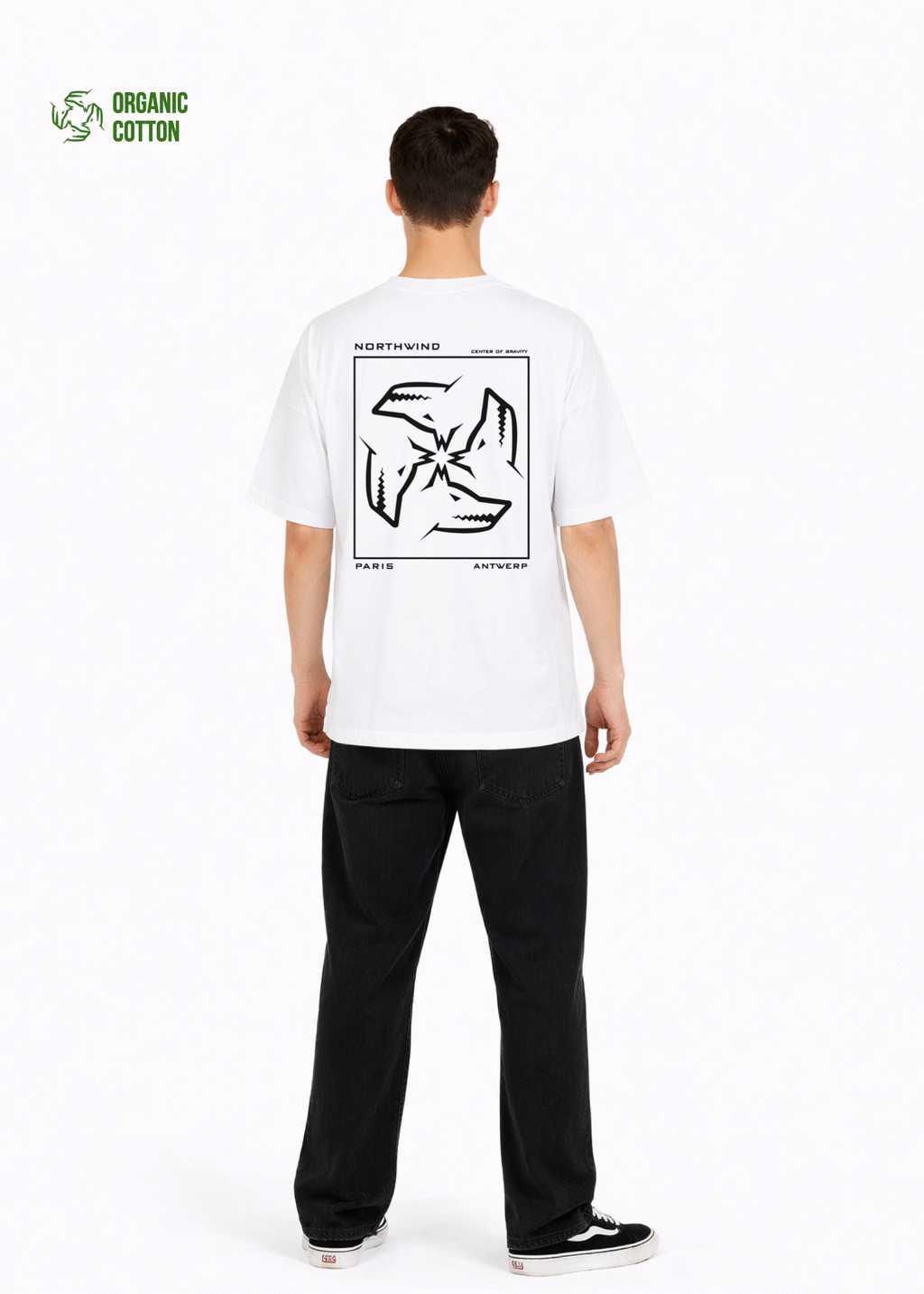 Young adult wearing a Northwind oversized organic cotton white t-shirt with Northwind embroidered on the chest, center of gravity design screen printed on the back, Carhartt pants, black Vans shoes