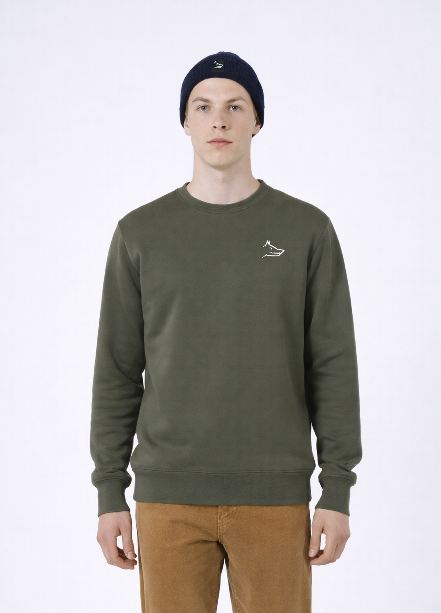 Man wearing a khaki green Northwind sweatshirt with white embroidered wolf logo of Northwind on the chest