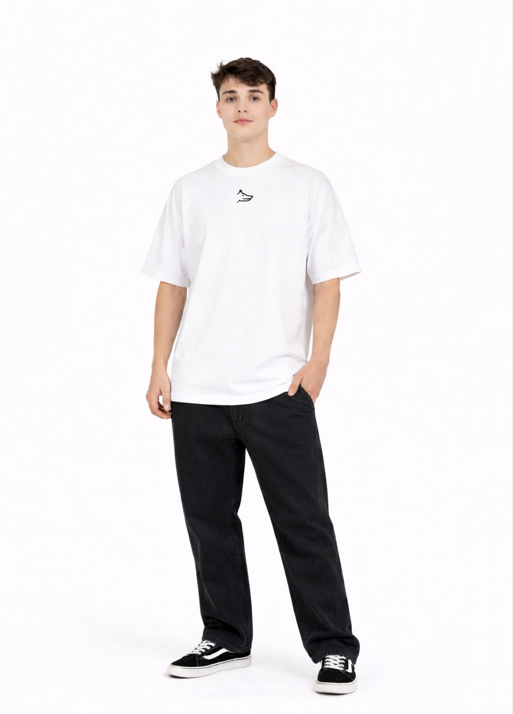 Young adult wearing a Northwind oversized organic cotton white t-shirt with Northwind wolf logo embroidered on the chest, Carhartt pants, black Vans shoes