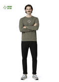 Man wearing a khaki green Northwind sweatshirt with white embroidered storm of wolves logo of Northwind on the chest, gray new balance shoes
