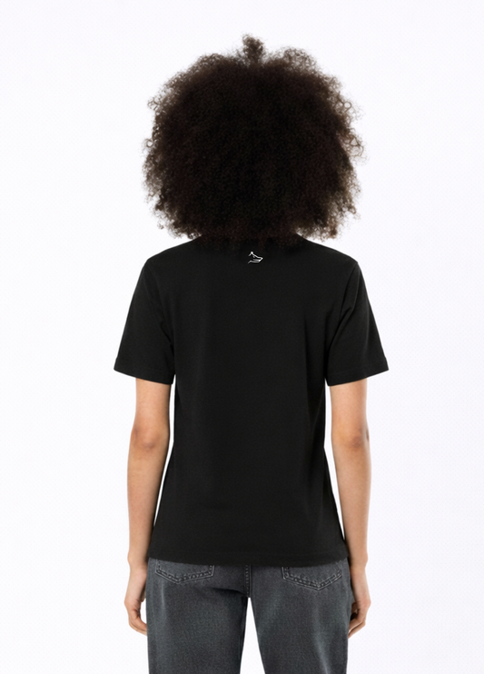 Woman wearing a black Northwind casual t-shirt with minimalist Northwind embroidered logo on the chest and Northwind wolf logo at the back, gray pants