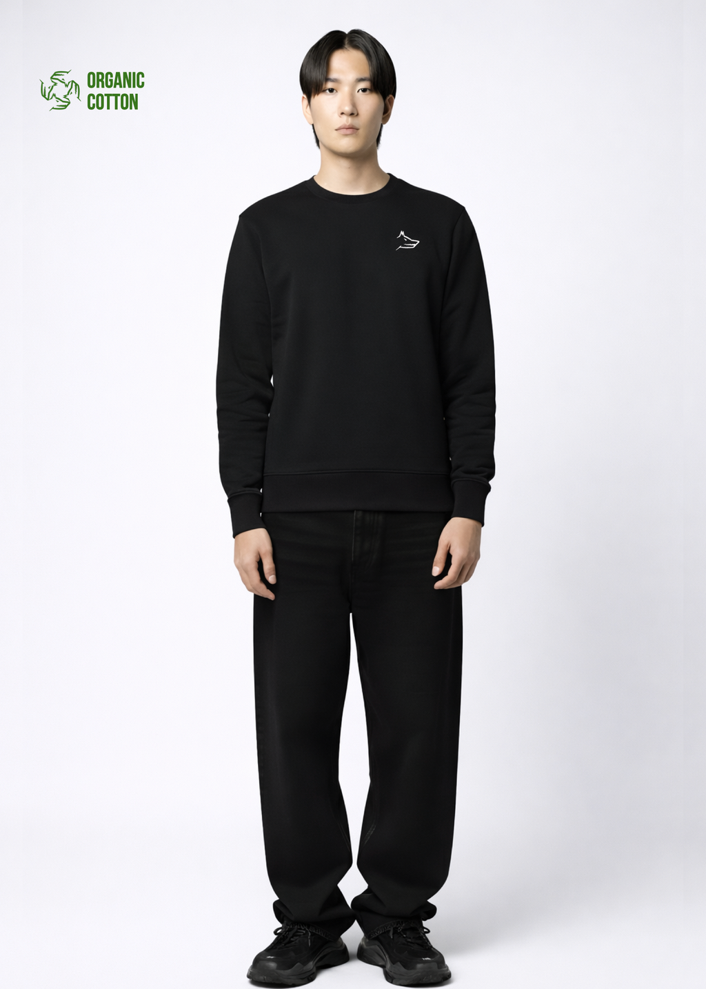 Asian model wearing a black organic cotton Northwind sweatshirt with white Northwind embroidered wolf logo on the chest