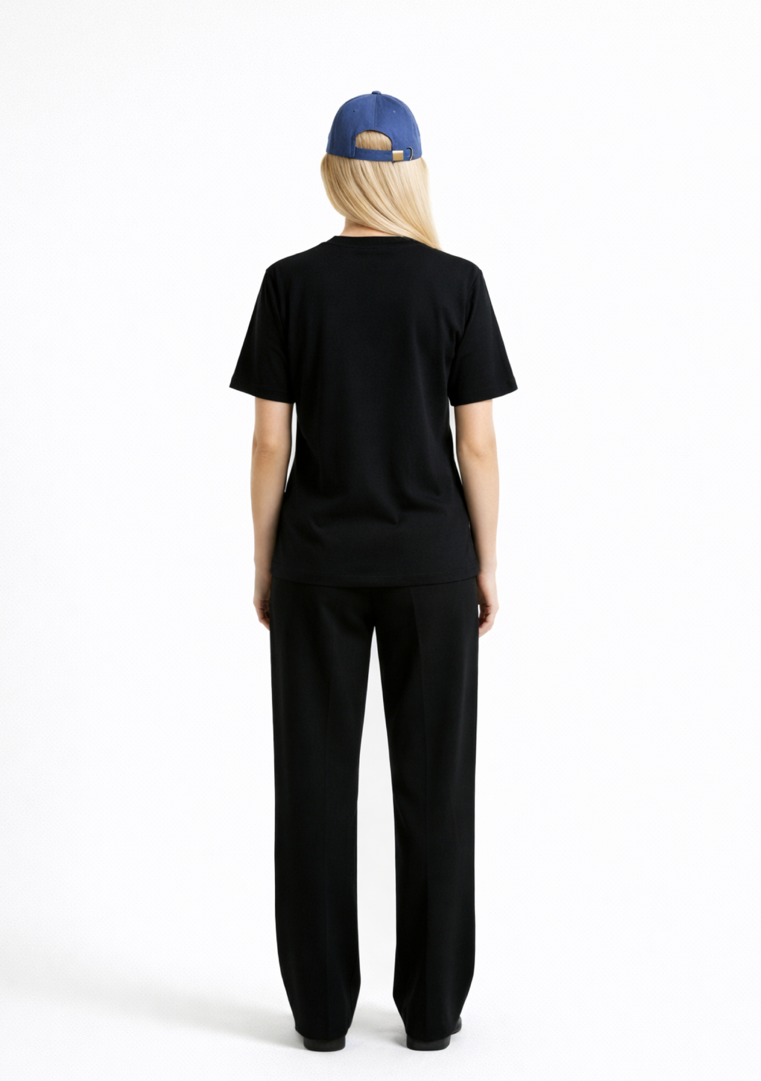 Blond woman wearing a black Northwind casual t-shirt, blue hat, black sunglasses and black pants on a white background