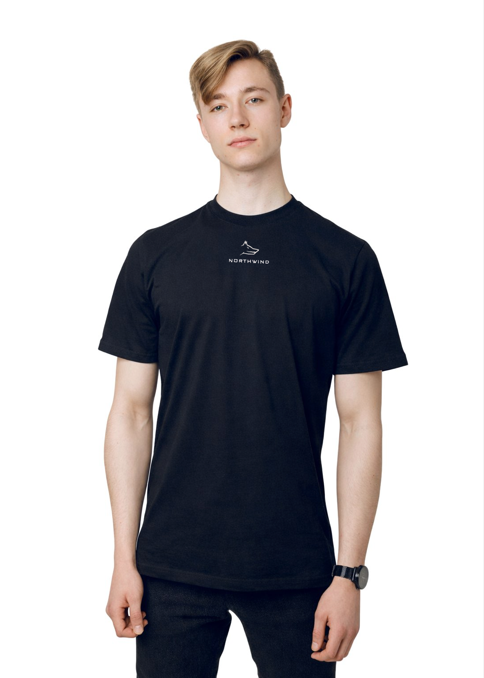 Blond man wearing a black Northwind casual t-shirt with minimalist Northwind embroidered wolf logo on the chest, black Casio watch