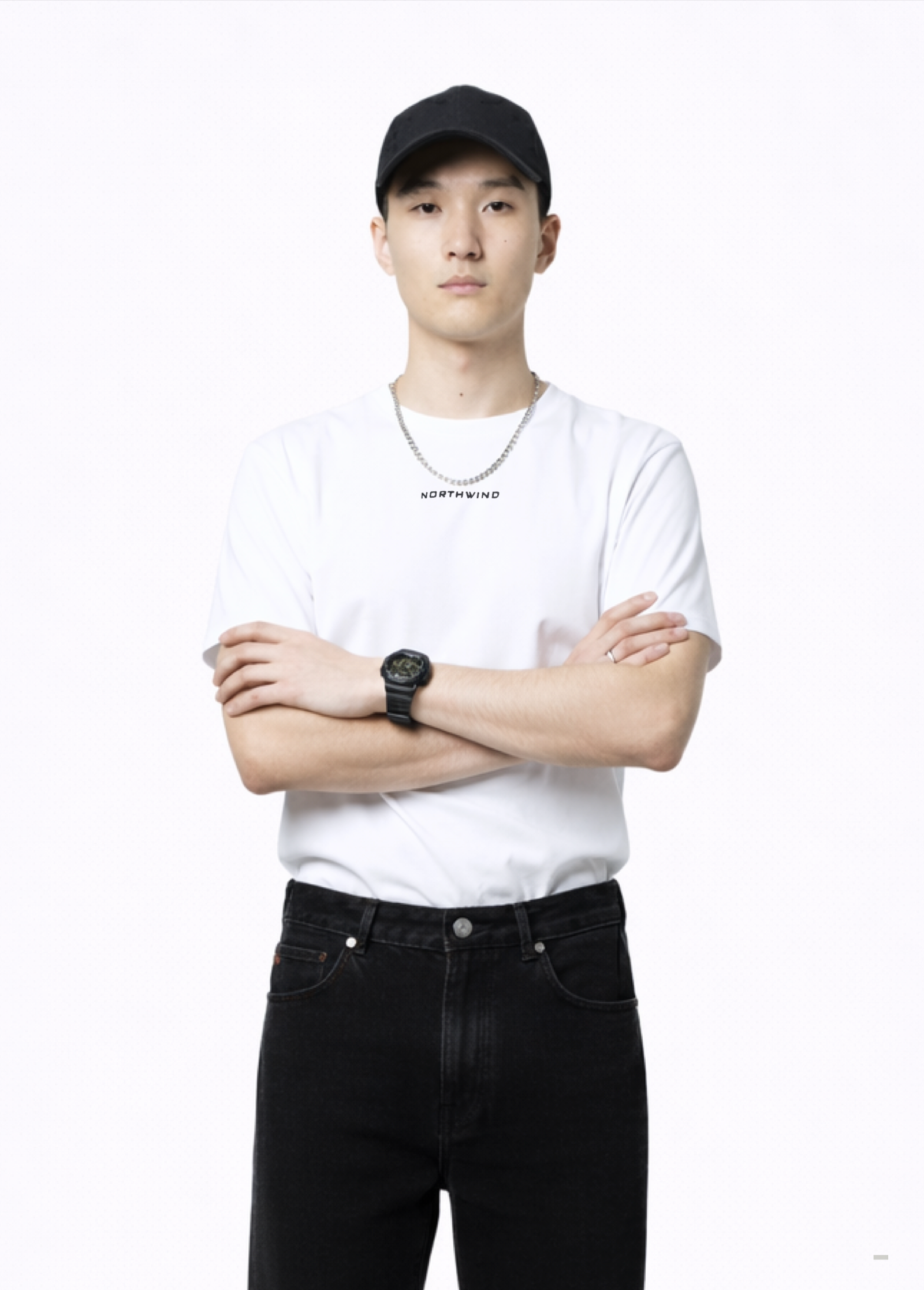 Man wearing an essential Northwind white t-shirt with minimalist Northwind embroidered wolf logo on the back, Black Rolex watch, Carhartt black pants