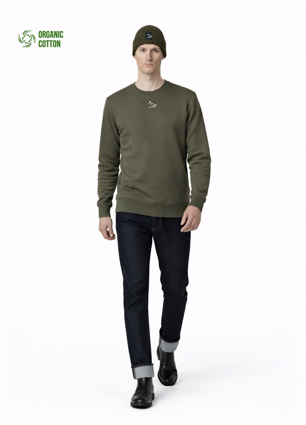 Man wearing a Northwind embroidered wolf logo khaki green sweatshirt and an olive green Northwind organic cotton beanie, and dark pants on a light gray background