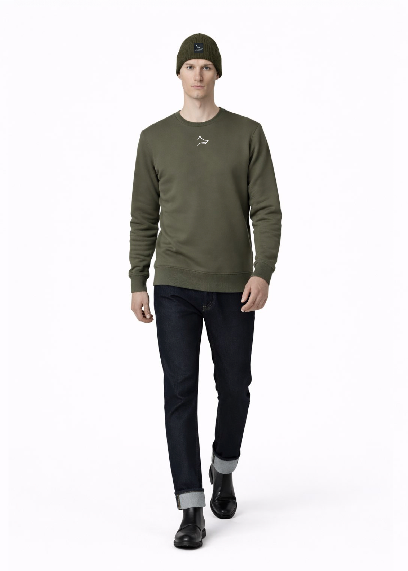 Man wearing a Northwind embroidered wolf logo khaki green sweatshirt and an olive green Northwind organic cotton beanie, and dark pants on a light gray background