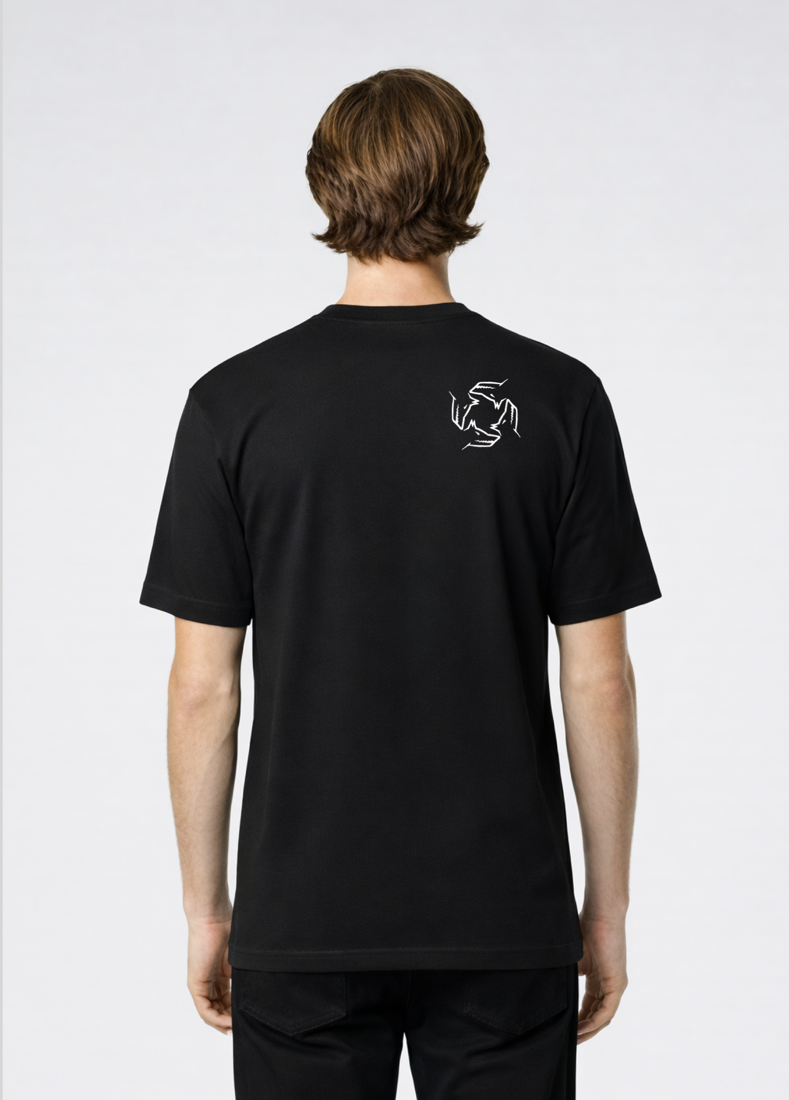 Man wearing a black Northwind storm of wolves t-shirt with embroidered Northwind storm of wolves logo on the back