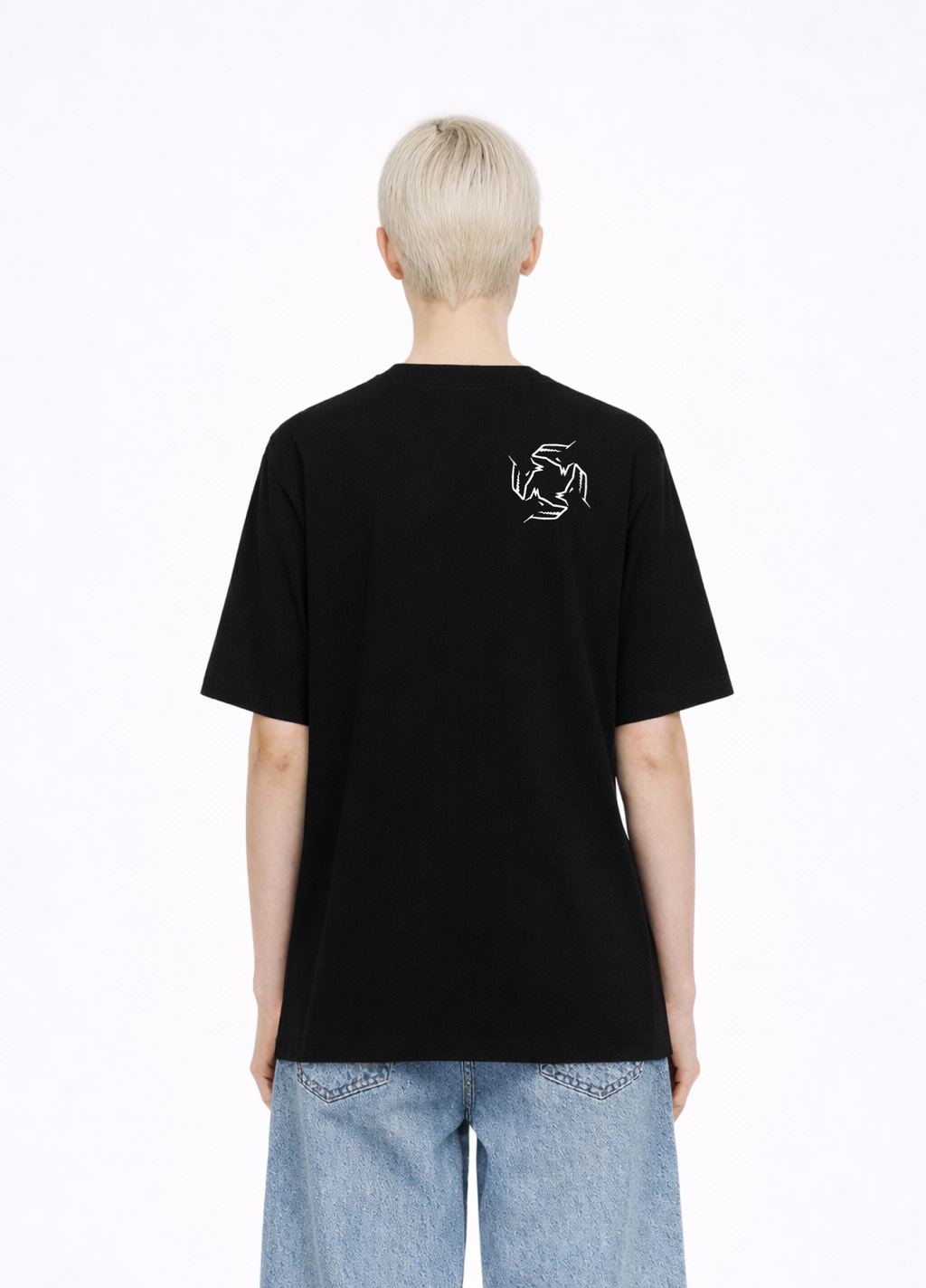 Blond, short hair girl wearing a black Northwind casual storm of wolves t-shirt with Northwind storm of wolves logo embroidered on the back, blue denim Carhartt oversized shorts
