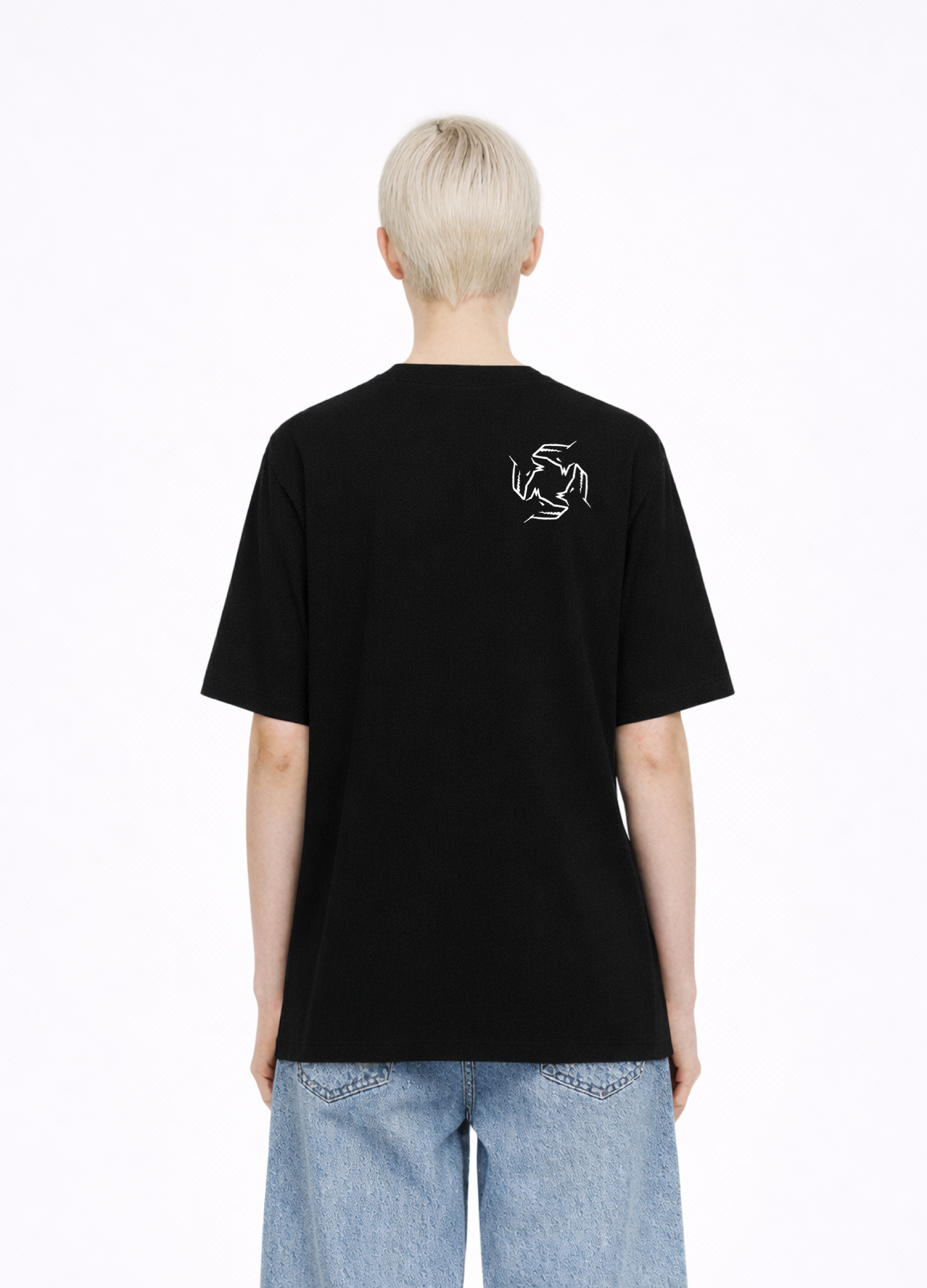 Blond, short hair girl wearing a black Northwind casual storm of wolves t-shirt with Northwind storm of wolves logo embroidered on the back, blue denim Carhartt oversized shorts
