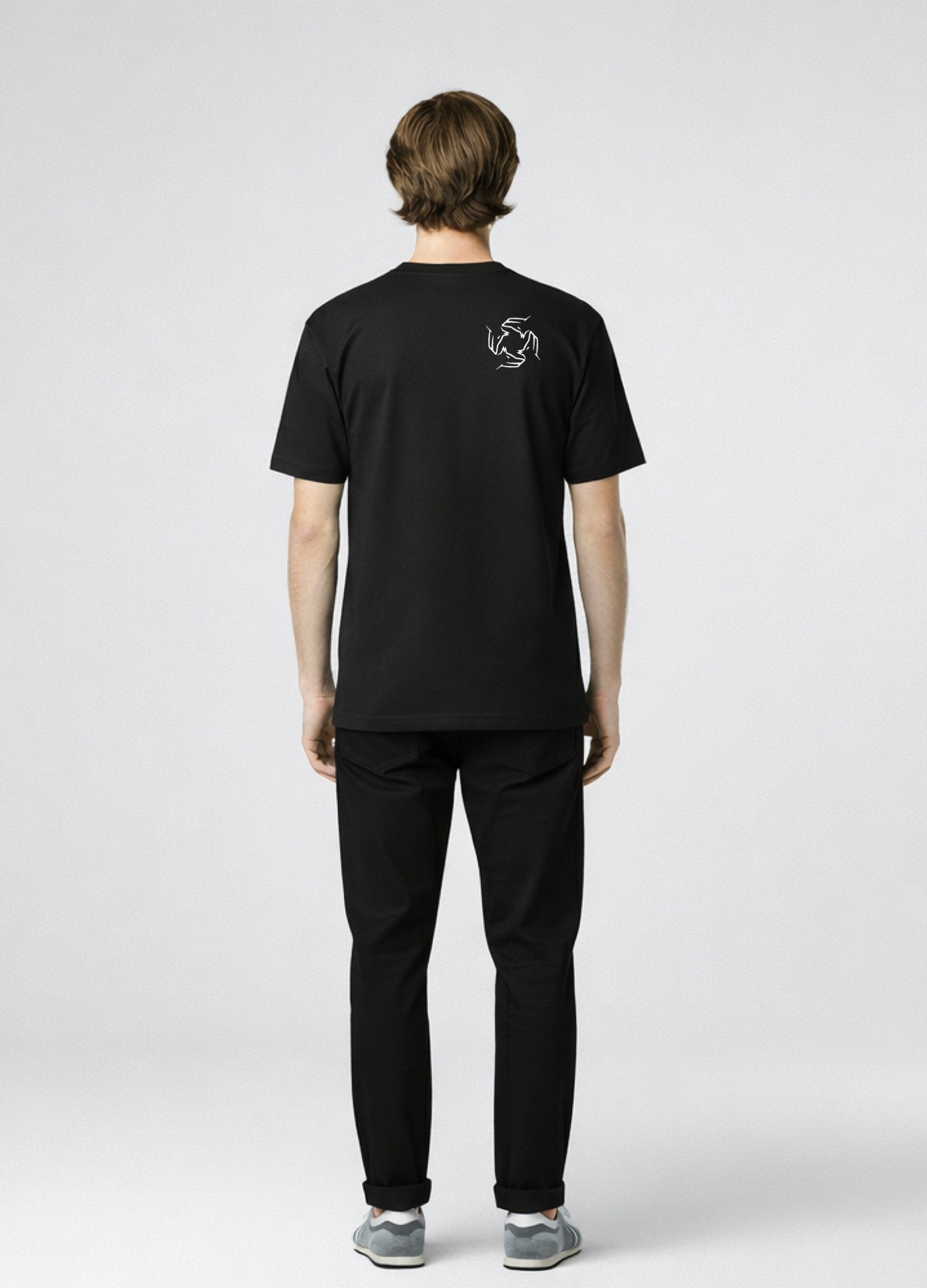 Man wearing a black Northwind storm of wolves t-shirt with embroidered Northwind storm of wolves logo on the back, gray New Balance shoes