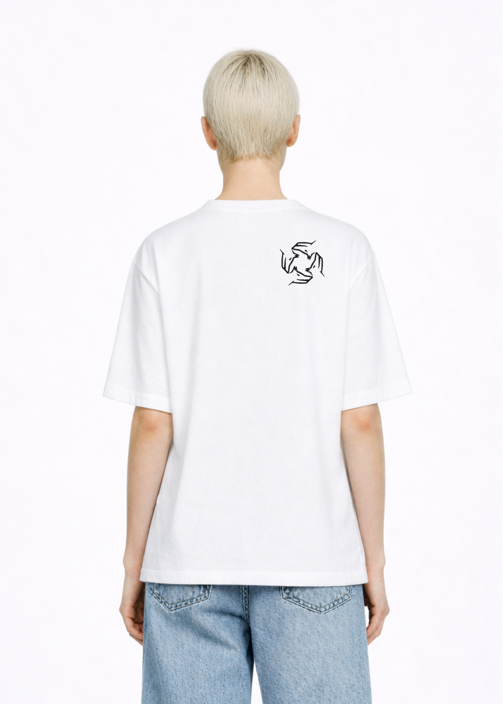 Blond, short hair girl wearing a white Northwind casual storm of wolves t-shirt with Northwind storm of wolves logo embroidered on the back, blue denim Carhartt oversized shorts