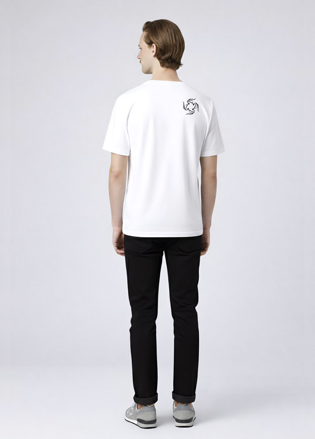 Man wearing a white Northwind storm of wolves t-shirt with embroidered Northwind storm of wolves logo on the back, gray New Balance shoes.