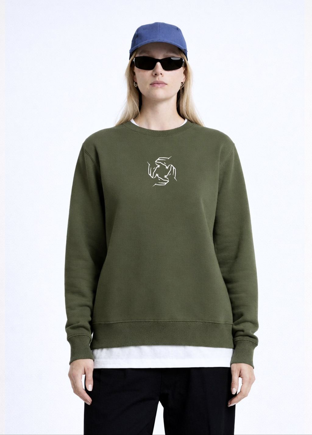 Woman wearing a khaki green Northwind sweatshirt with Northwind storm of wolves embroidered logo on the chest, black pants, and a black beret on a white background