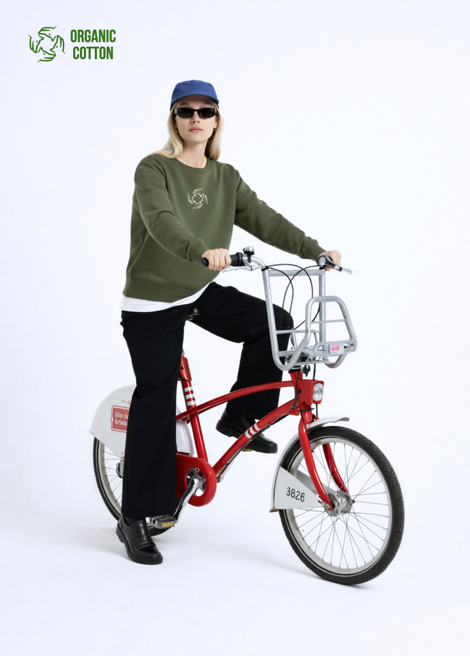 Person riding a red Antwerp city bicycle, wearing Northwind sweatshirt with storm of wolves embroidered logo on the chest