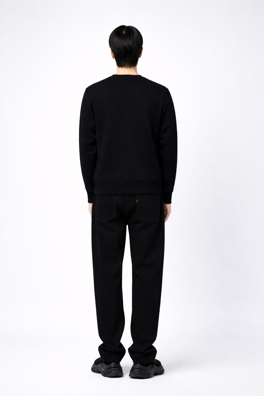 Person wearing a black Northwind sweatshirt on a white background