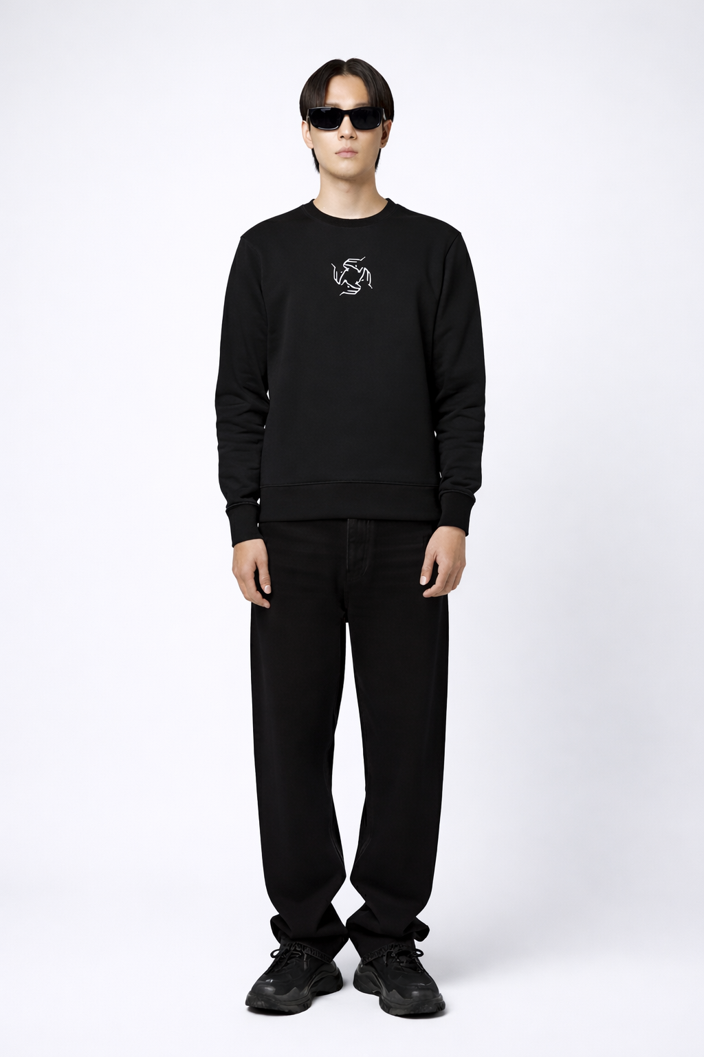 Person wearing a black Northwind sweatshirt with Northwind wolf storm logo on a white background