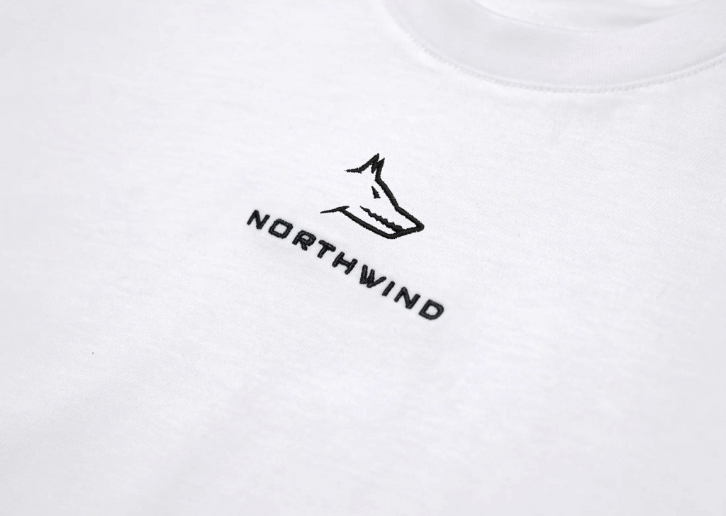 White t-shirt with 'Northwind' logo on a light gray background