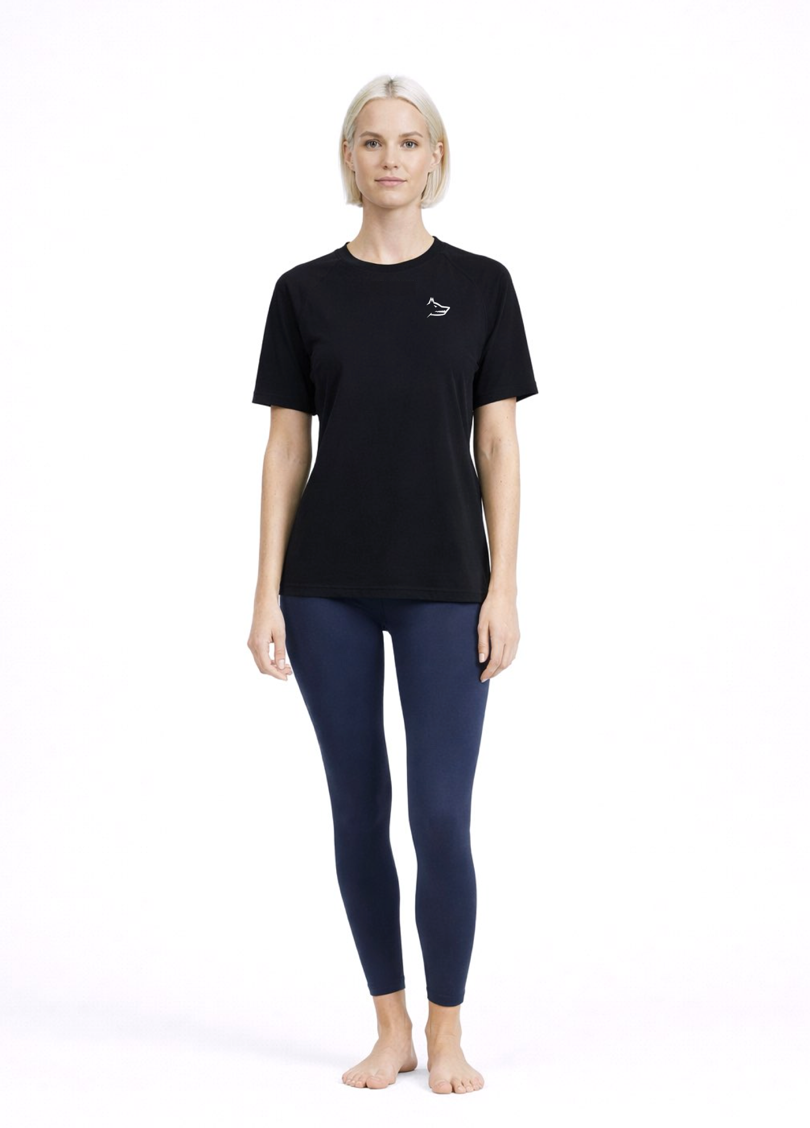 Woman wearing a black Northwind activewear t-shirt with Northwind wolf logo on the chest, navy legging