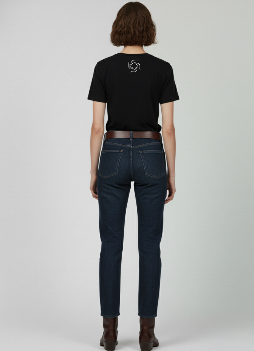 A woman wearing a Northwind black t-shirt and dark jeans on a white background